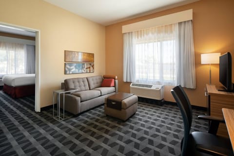 Suite, 1 Bedroom | Living room | 1-inch flat-screen TV with satellite channels, TV
