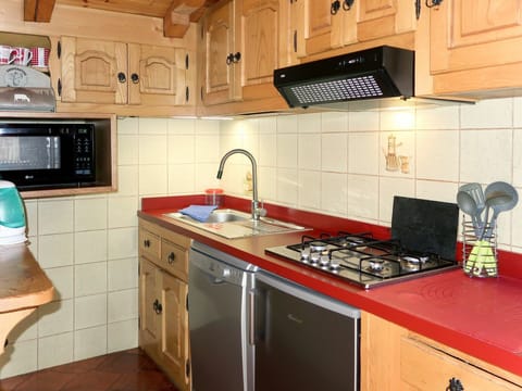 Countertop, Cabinetry, Kitchen, Room, Furniture, Property, Tile, Kitchen Stove, Gas Stove, Floor
