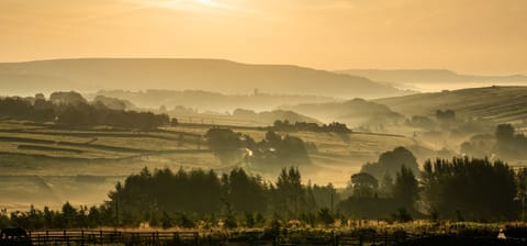 Autumn mist over the land surrounding Sutcliffe Barn looking towards Heptonstall