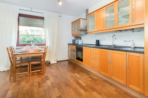 Kitchenette with oven and refrigerator. 