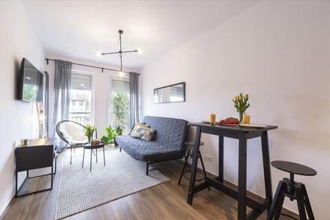 Living room with a comfortable sofa and TV. 