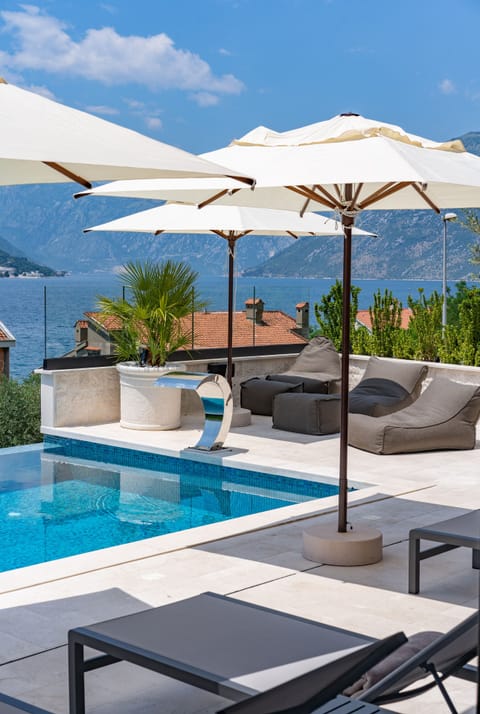 Seasonal outdoor pool, pool umbrellas, sun loungers