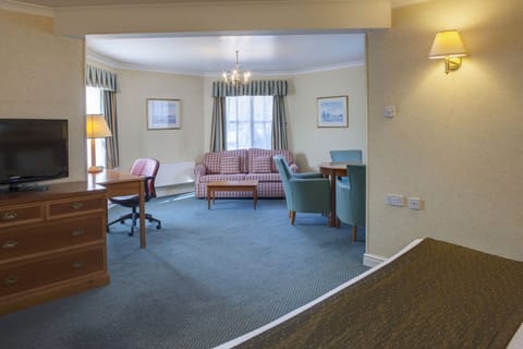 Suite, 1 King Bed | Minibar, in-room safe, desk, iron/ironing board