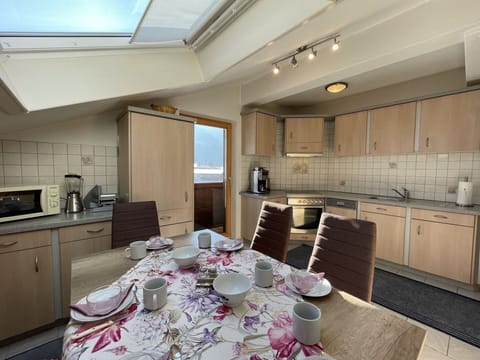 Table, Furniture, Cabinetry, Property, Tableware, Countertop, Chair, Lighting, Interior Design, Building