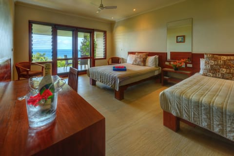 Deluxe Ocean View Room | 1 bedroom, iron/ironing board, WiFi, bed sheets