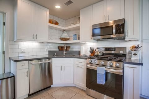 A 2021 renovated kitchen creates an open concept living area.
