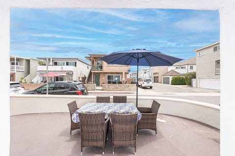 Ocean view from the coveted corner front patio, one house back from beachfront.