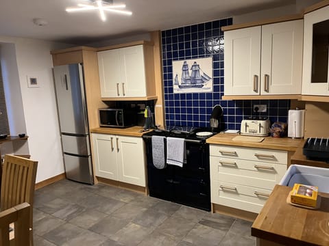View of the kitchen with Rayburn range cooker