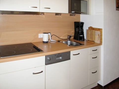 Countertop, Kitchen, Property, Room, Cabinetry, Furniture, Major Appliance, Kitchen Stove, Interior Design, Drawer