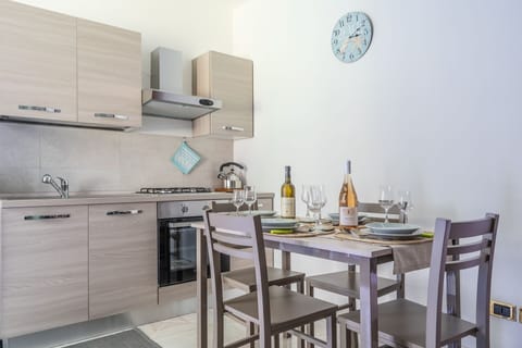 Apartment, 2 Bedrooms, Patio, Sea View | Private kitchen | Full-size fridge, microwave, oven, stovetop