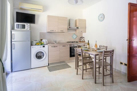 Apartment, 2 Bedrooms, Patio, Sea View | Private kitchen | Full-size fridge, microwave, oven, stovetop