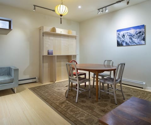 New queen-sized Murphy bed that can be accessed by moving the dining table