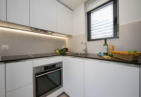 Family Apartment, 1 Bedroom (Urban Flat Paradiso) | Private kitchen | Full-size fridge, oven, stovetop, dishwasher