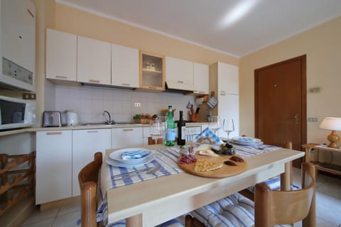 Family Apartment, 1 Bedroom (Petalo Bianco 100m from lake) | Private kitchen | Full-size fridge, microwave, oven, stovetop