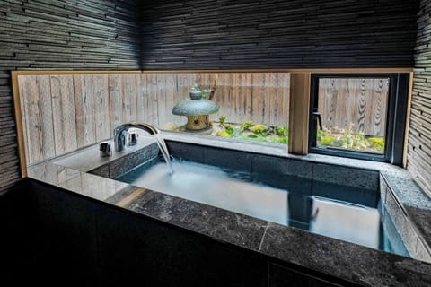 Townhome | Bathroom | Separate tub and shower, deep soaking tub, free toiletries, hair dryer