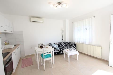 Apartment, 1 Bedroom | Living area | Flat-screen TV
