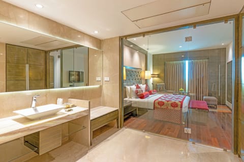 Suite, 1 King Bed | Bathroom | Designer toiletries, hair dryer, bathrobes, slippers