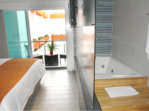 Deluxe Double Room | Bathroom | Shower, designer toiletries, hair dryer, bathrobes