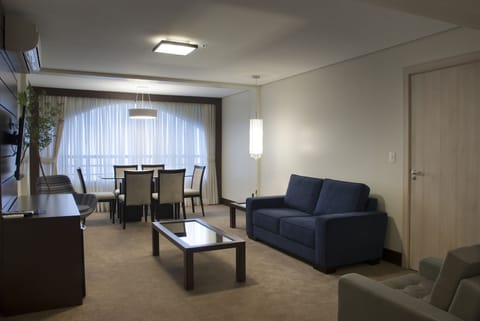 Premier Room | Living area | 50-inch LCD TV with cable channels, TV