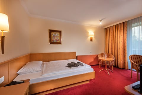 Comfort Single Room, Balcony, Garden View | In-room safe, desk, free WiFi, bed sheets