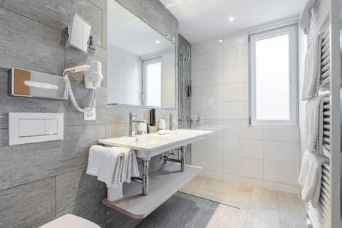 Deluxe Apartment, Balcony, Mountain View | Bathroom | Eco-friendly toiletries, hair dryer, bathrobes, slippers