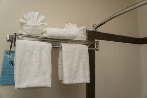 Standard Room, 2 Queen Beds, Non Smoking | Bathroom | Combined shower/tub, hair dryer, towels, soap