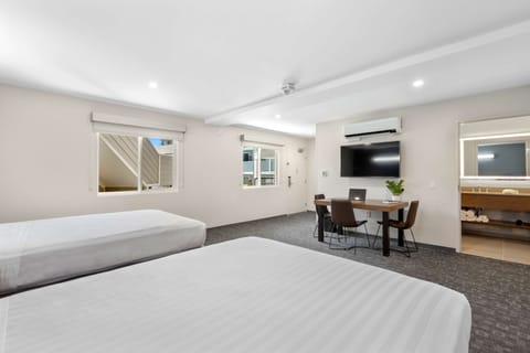 Deluxe Room, 2 Queen Beds, Courtyard Area | Desk, iron/ironing board, free WiFi, bed sheets