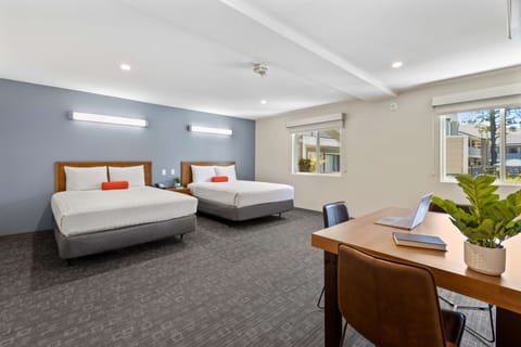 Deluxe Room, 2 Queen Beds, Courtyard Area | Desk, iron/ironing board, free WiFi, bed sheets