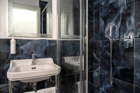 Shower, free toiletries, hair dryer, slippers