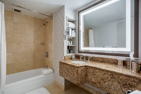 Suite, 1 Bedroom (1 King Bed) | Bathroom | Combined shower/tub, free toiletries, hair dryer, bathrobes