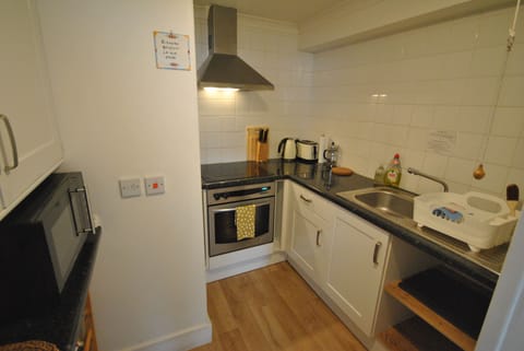 Sarah Self-Catering Apartment | Private kitchen | Full-size fridge, microwave, dishwasher, electric kettle