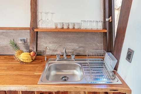 Full-size fridge, stovetop, coffee/tea maker, toaster