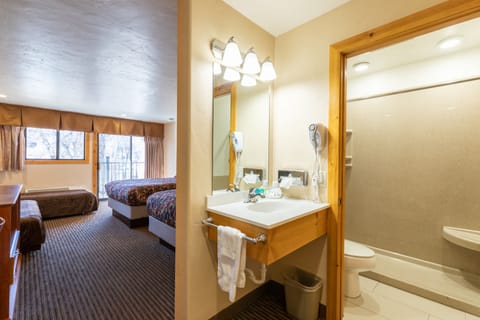 Deluxe Room, 2 Queen Beds | Bathroom | Shower, free toiletries, hair dryer, towels