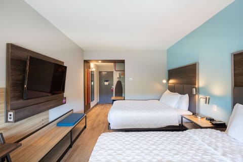 Hypo-allergenic bedding, desk, laptop workspace, blackout drapes