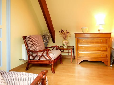 Room, Furniture, Floor, Property, Interior Design, Yellow, Hardwood, Bedroom, Table, House