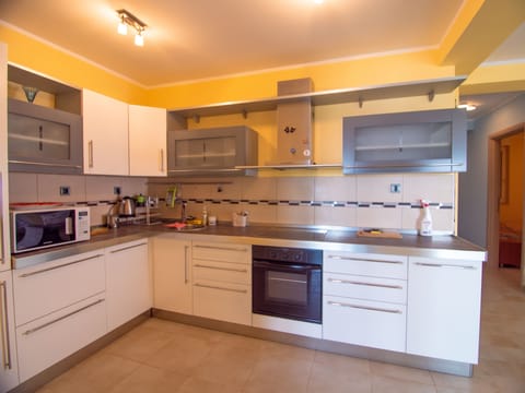 Panoramic Apartment | Private kitchen | Electric kettle, highchair