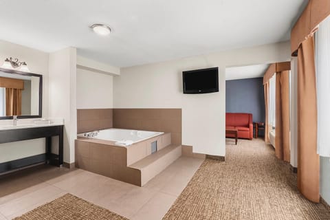 Premium bedding, desk, laptop workspace, blackout drapes