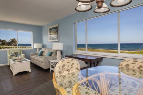 Suite, Oceanfront | Living area | 32-inch flat-screen TV with cable channels, TV