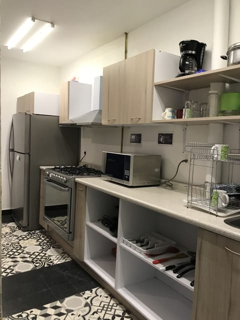 Fridge, microwave, stovetop, coffee/tea maker