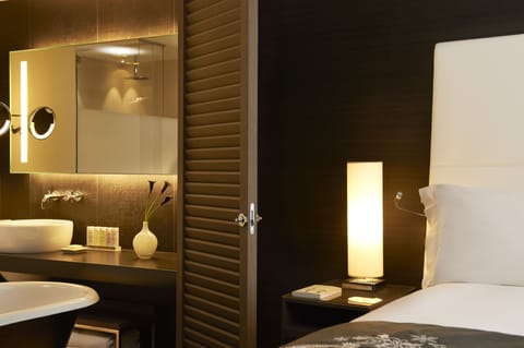 Separate tub and shower, designer toiletries, hair dryer, bathrobes