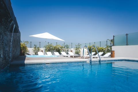 Outdoor pool, open 10:00 AM to 6:00 PM, pool umbrellas, sun loungers