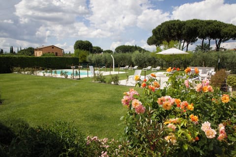 Seasonal outdoor pool, open 9:00 AM to 8:30 PM, pool umbrellas