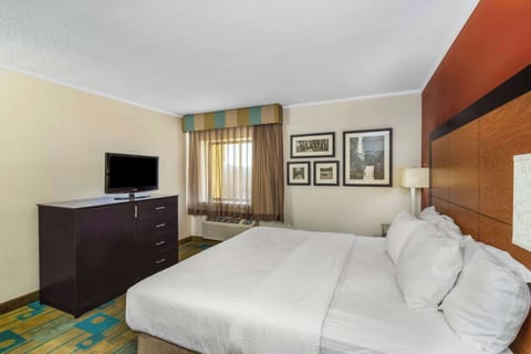 Suite, 1 King Bed, Non Smoking | Desk, laptop workspace, blackout drapes, iron/ironing board