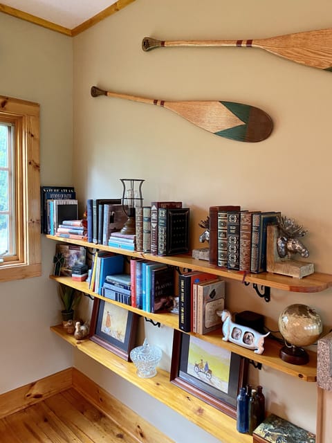 Upper level seating area  with a selection of books for reading