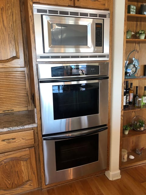 Full kitchen w 5 burner stove, cooking island, dishwasher, 3 refrigs on site.