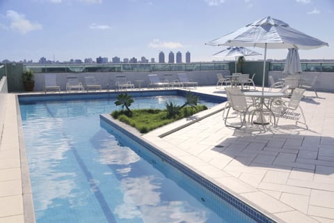 Outdoor pool, pool umbrellas, sun loungers