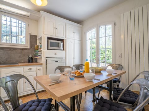 Table, Furniture, Property, Window, Cabinetry, Chair, Wood, Interior Design, Lighting, Yellow