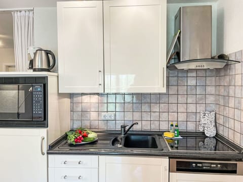 Kitchen Appliance, Kitchen, Countertop, Major Appliance, Cabinetry, Sink, Plumbing Fixture, Home Appliance, Kitchen Sink, Interior Design