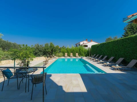 Sky, Plant, Swimming Pool, Building, Blue, Chair, Outdoor Furniture, Shade, Tree, Table