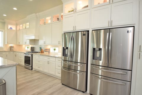 2 refrigerators with water and ice dispensors